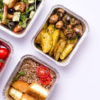 Home delivery concept. Food in containers on a white background.